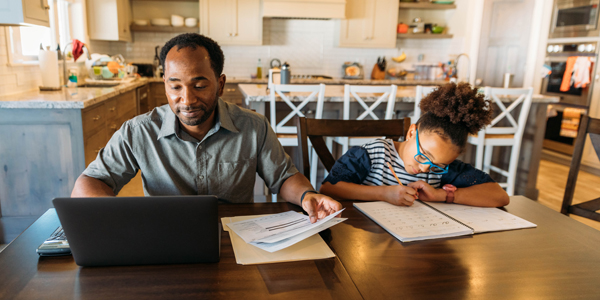 50/30/20 Rule Blog Adult and child at a table