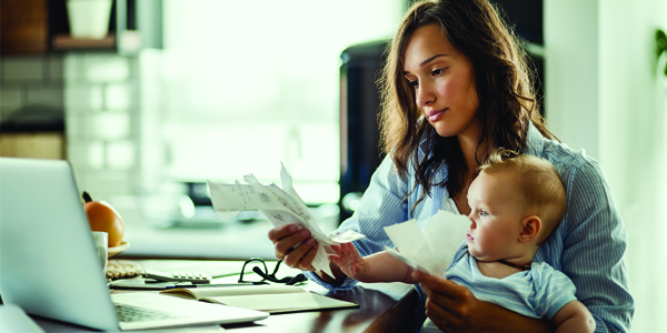 Adult and infant looking at receipts