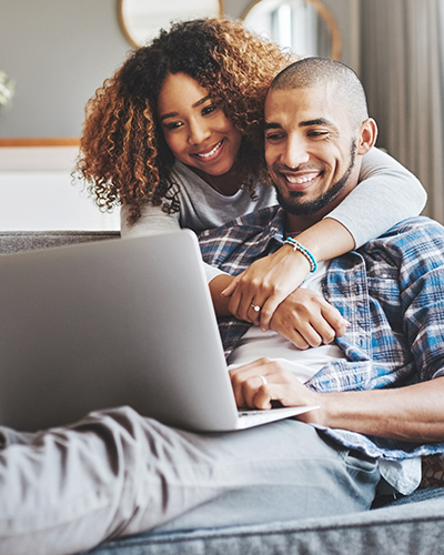 Couple looking at a laptop