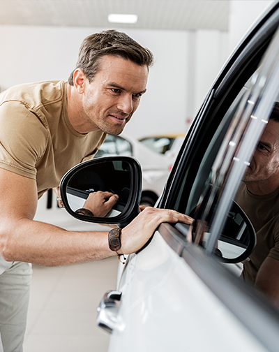 Man shopping at a car dealership