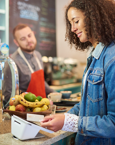 Woman shopping with contactless credit card