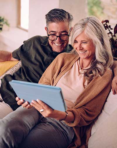 Couple reviewing iPad 